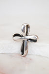 Silver cross pendant on a white background