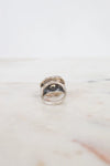 Silver ring on a marble surface