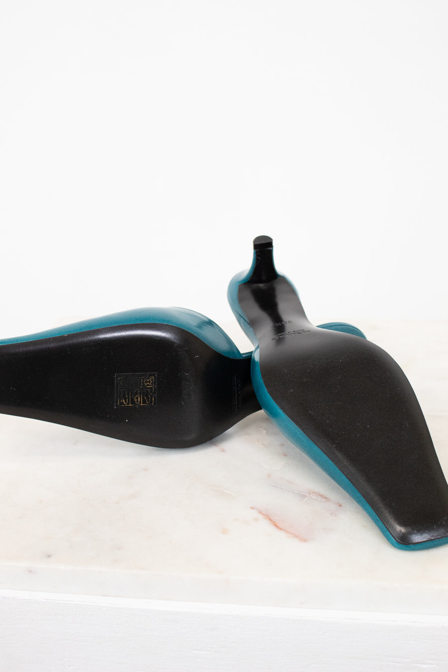 Black soles on shoes on a white background