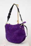 Purple handbag with black strap and gold accents on a white background