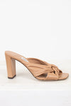Tan high-heeled sandal with a knot detail on a white background