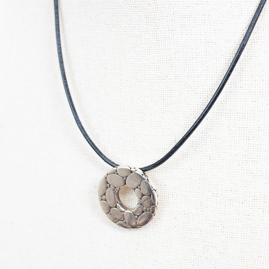 Necklace with a circular pendant on a white background