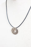 Necklace with a circular pendant on a white background
