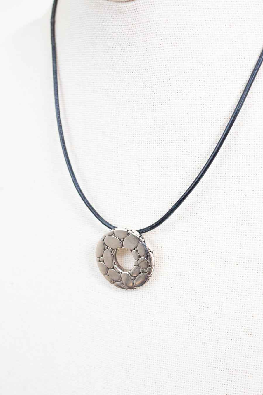 Necklace with a circular pendant on a white background
