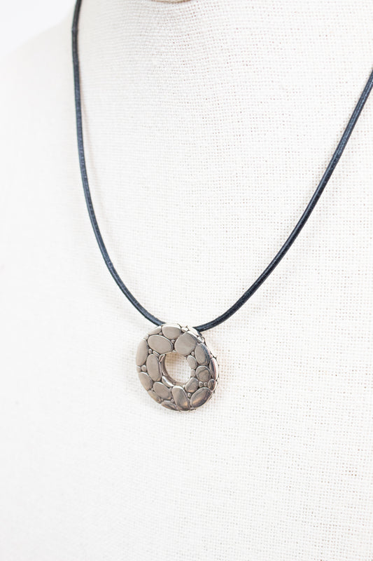 Necklace with a circular pendant on a white background