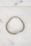 Silver bracelet on a marble surface