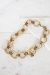 Gold chain necklace on a marble surface