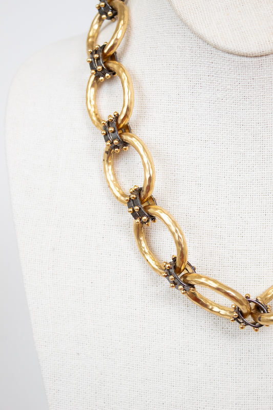 Gold chain necklace on a white background