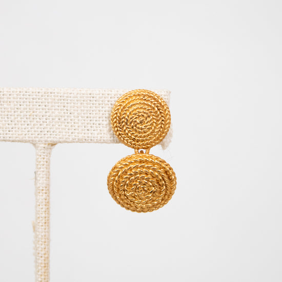 Gold earrings on a white background