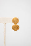 Gold earrings on a white background