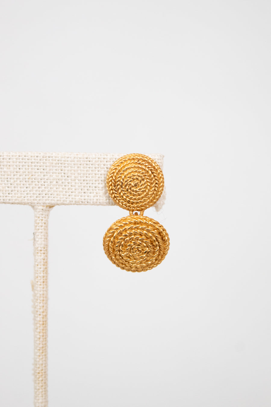 Gold earrings on a white background