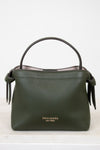 Green handbag with 'kate spade new york' logo on a white background