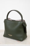 Green handbag with 'kate spade new york' logo on a white background