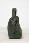 Green leather handbag on a white background