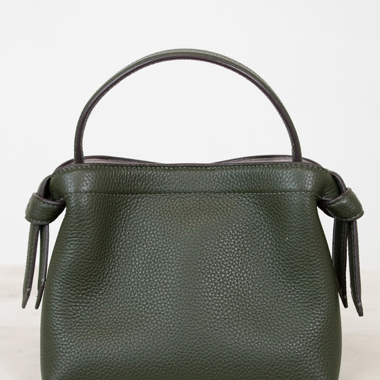 Green handbag with a handle on a white background
