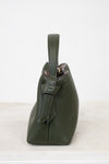 Green leather handbag on a white background