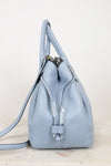 Light blue leather purse on a light gray background