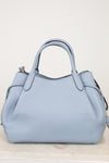 Light blue handbag on a white background