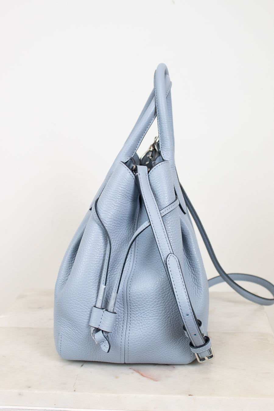 Light blue purse on a white background