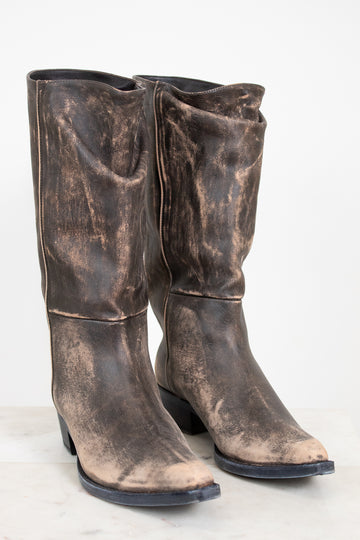 Pair of distressed brown leather boots on a white background