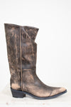Distressed brown leather boot on a white background