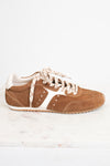A single brown suede sneaker with cream-colored laces and side stripes, displayed on a white marble surface against a white background.