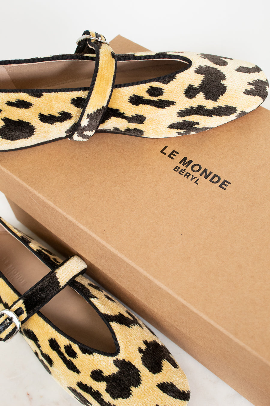 Leopard print shoes with a 'Le Monde Beryl' box in the background