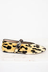 Leopard print flat shoe with a strap on a white background