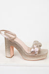 Silver glitter high-heeled sandal on a white background