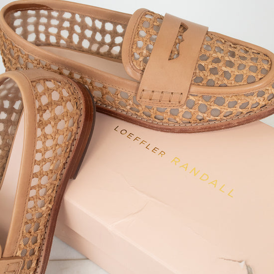 Tan loafers with woven design on a marble surface with 'LOEFFLER RANDALL' branded box.