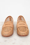 Pair of tan woven loafers on a light background