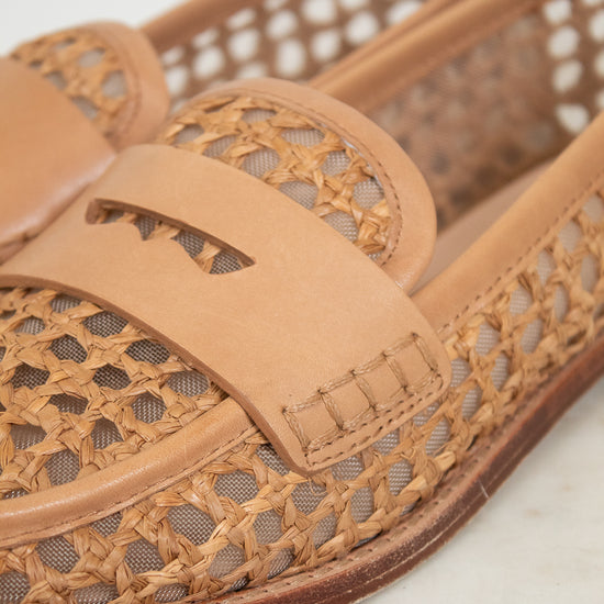 Tan woven sandal on a light background
