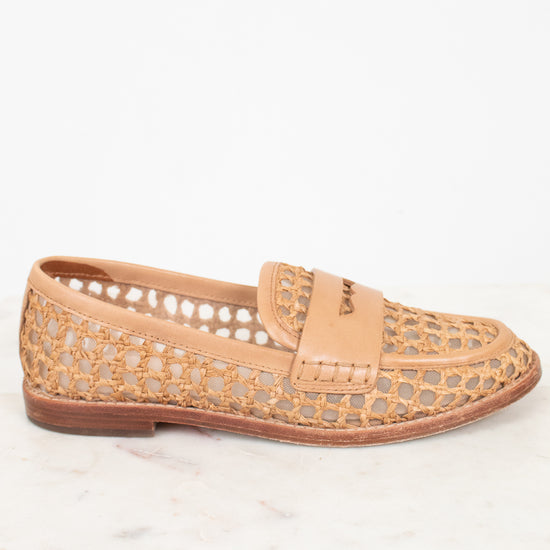 Tan woven loafer shoe on a white background.