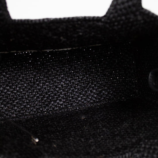 Close-up of black textured handbag interior on a white background