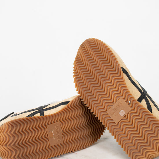 Pair of shoes with textured soles on a light background