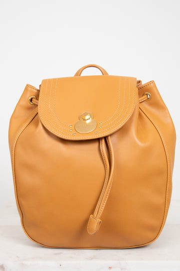 Orange backpack with a gold clasp on a white background