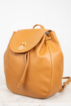 Tan leather backpack on a white background