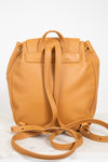Tan leather backpack with a strap on a white background