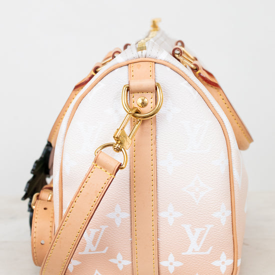 Designer handbag with visible brand logo on a light background