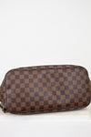 Brown checkered handbag on a white background