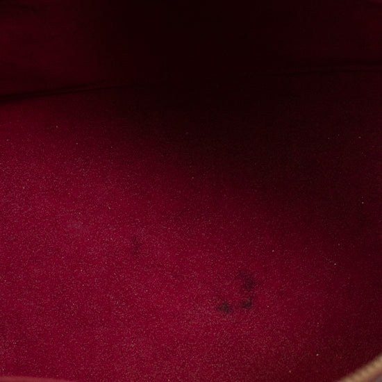 Close-up of a red fabric interior with a zipper