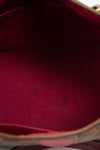 Close-up of a red fabric interior with a zipper