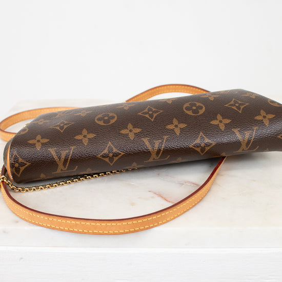 Louis Vuitton monogram handbag on a light background