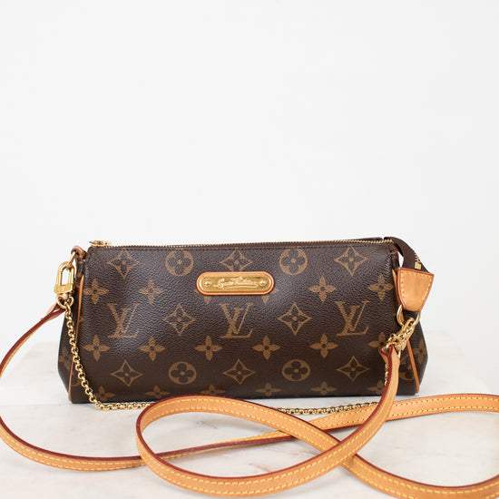 Louis Vuitton handbag with monogram pattern on a white background