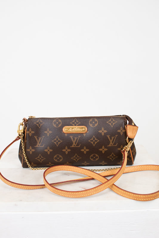 Louis Vuitton handbag with monogram pattern on a white background