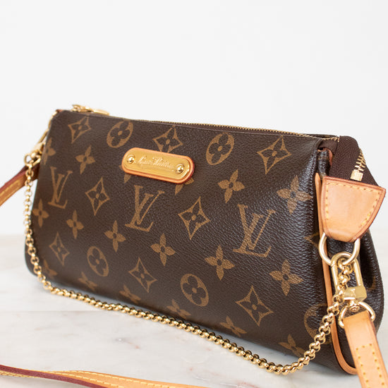 Louis Vuitton handbag with monogram pattern on a light background