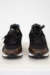 Black sneakers with brown monogram pattern on a white background
