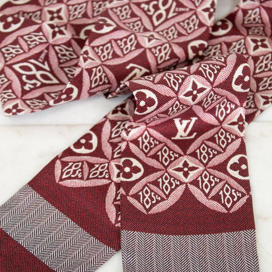 Louis Vuitton scarf with patterned design on a white background
