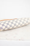 Checkered clutch bag on a marble surface