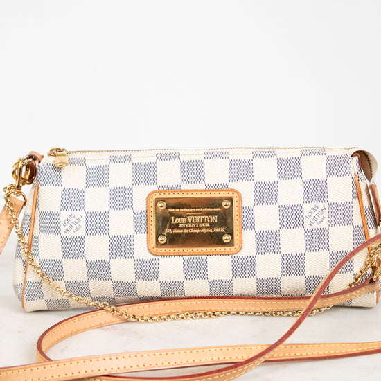 Louis Vuitton handbag with checkered pattern on a white background